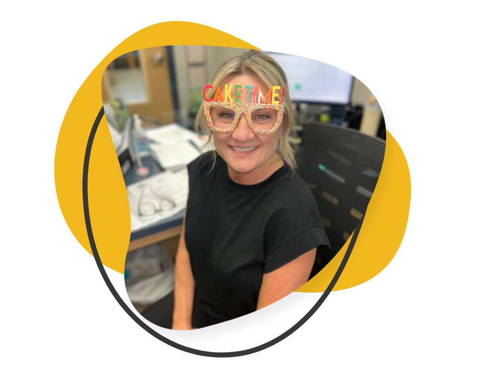 smiling receptionist wearing funny sunglasses